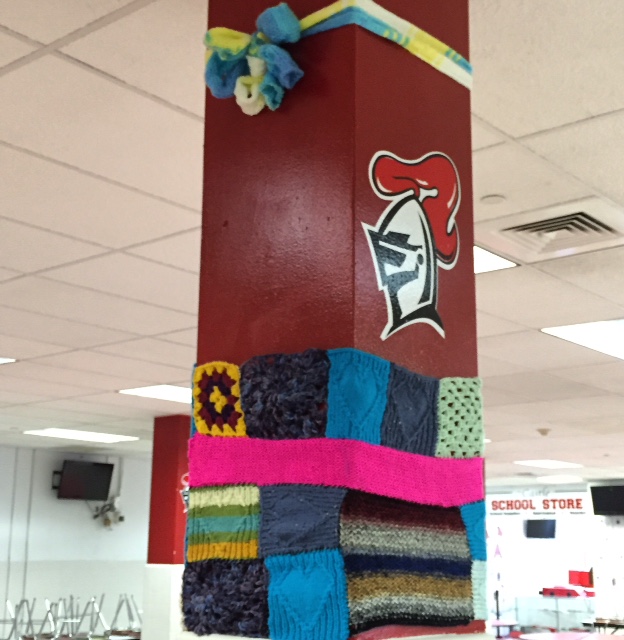 String Theory yarnstormed a cafeteria pillar to raise awareness about the stress-relieving powers of the fiber arts.