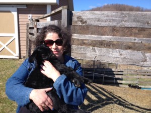 Fernanda cuddled this baby goat, which fell asleep in her arms.