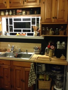 More shelving under the cabinets means less on the counter top.  We also raised the height of this cart so that it is truly an extension of the counter top.