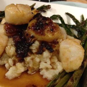 Bacon marmalade makes a glaze for sautéed scallops over risotto with a side of roasted asparagus.