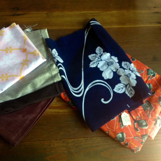 Sale finds include silk remnants, a 1/2 yard cut of cotton laminate, a piece of vintage Japanese katagami fabric, and three yards of telephone print.