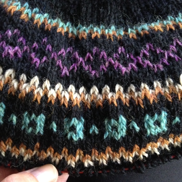 The colorwork yoke of my Bressa dress. I hold the contrasting color in my left hand, the main color in my right.