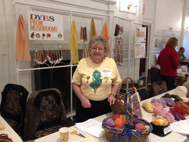 Ursula with her beautiful display of yarn and fiber dyed with mushrooms.